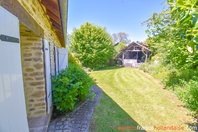 Twee woningen met een parktuin